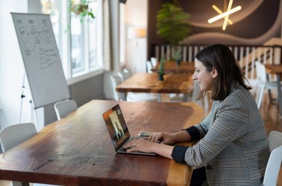 smiling woman at laptop