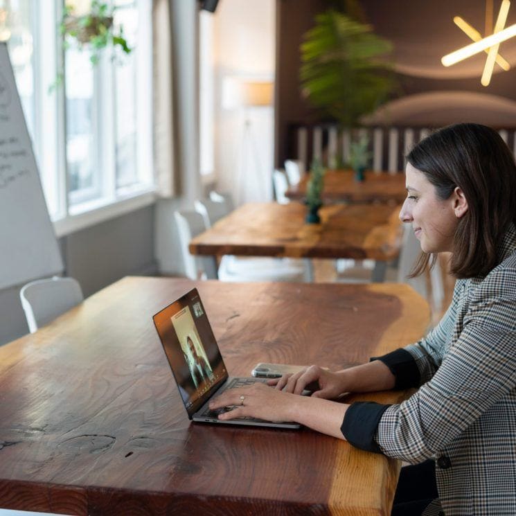 smiling woman at laptop